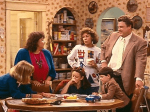 John Goodman, Roseanne Barr, Sara Gilbert, Michael Fishman, Alicia Goranson, and Laurie Metcalf in Roseanne (1988)