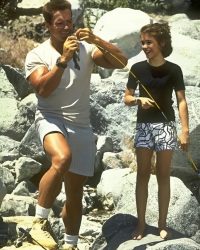 Actor Alyssa Milano and Arnold Schwarzenegger in Commando (1985