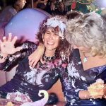 British glamour model Linda Lusardi (left) is treated to a cake fight at her birthday party, circa 1985