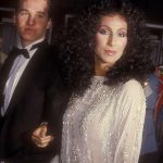 Cher wearing Bob Mackie with Val Kilmer at the 55th Academy Awards at the Dorothy Chandler Pavilion in Los Angeles on April 11, 1983.